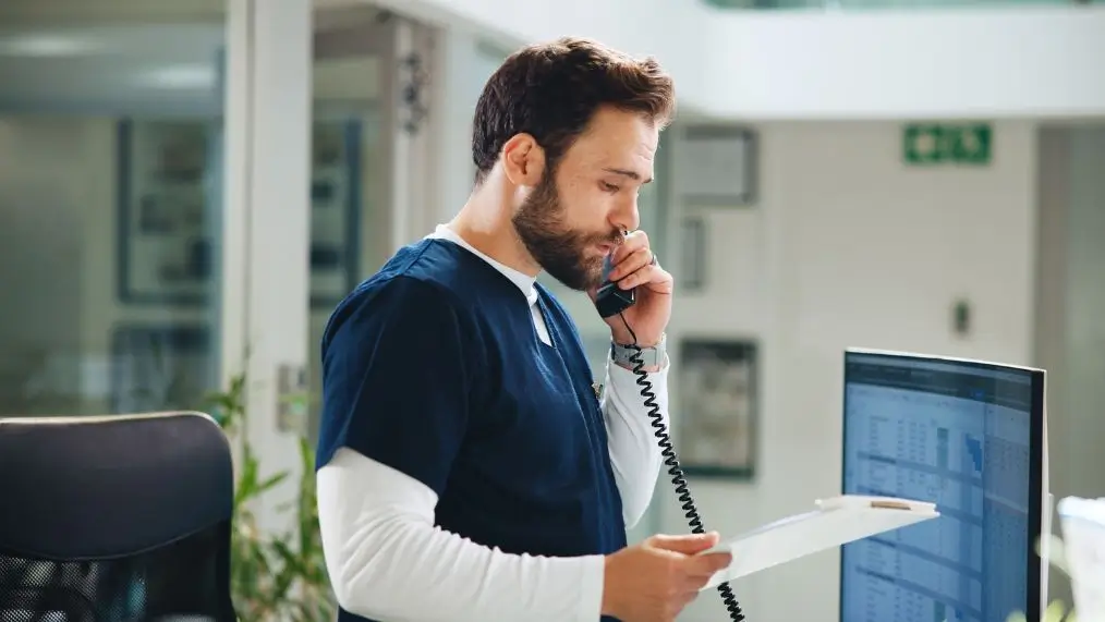 Healthcare office worker on phone