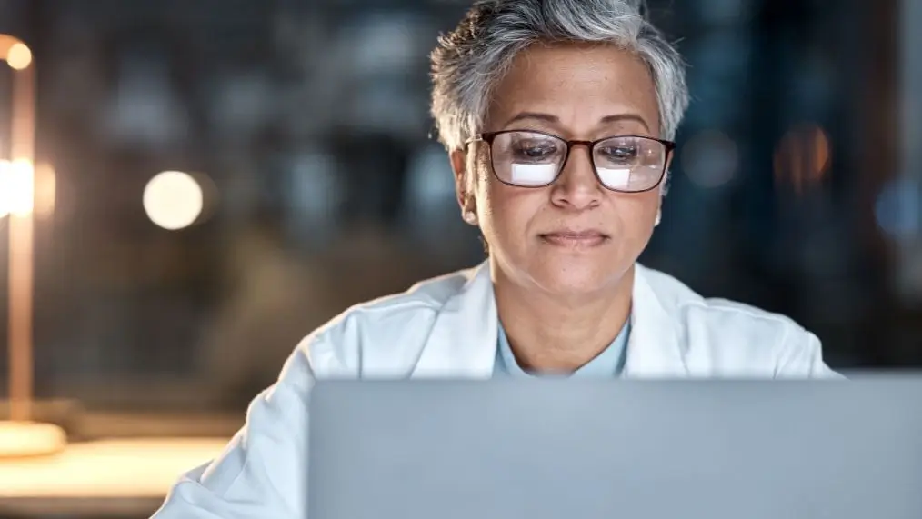 Female doctor looking at computer screen